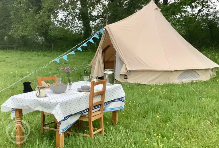 Bell tent and outdoor dining area
