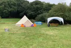 Bell tent and outdoor dining area Bell tent and outdoor dining area
