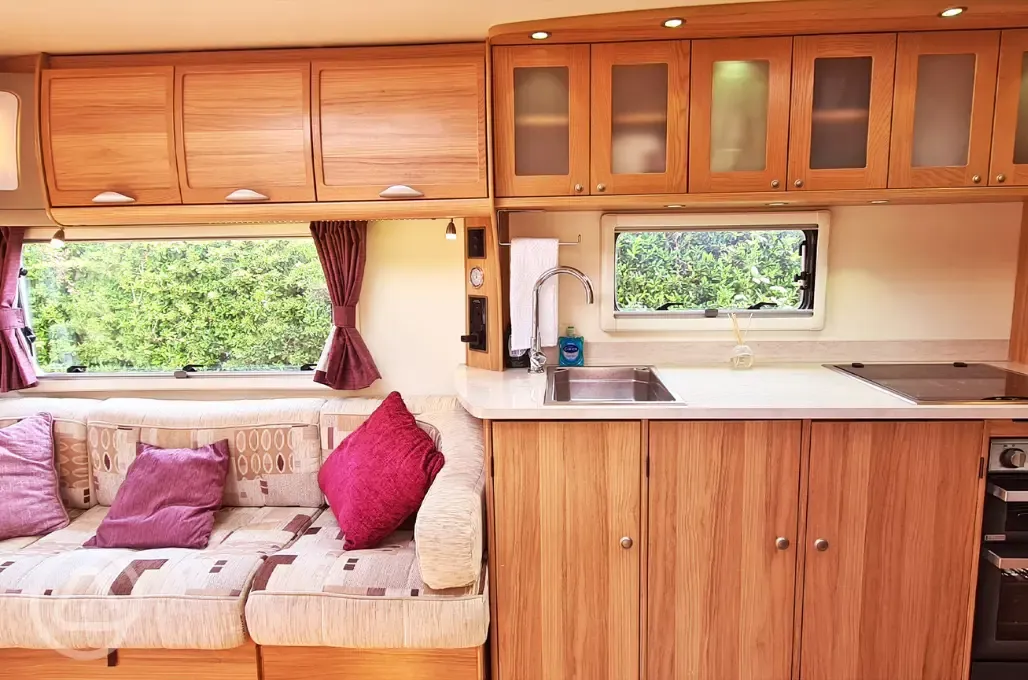 Touring caravan kitchen and seating area