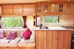 Touring caravan kitchen and seating area Touring caravan kitchen and seating area