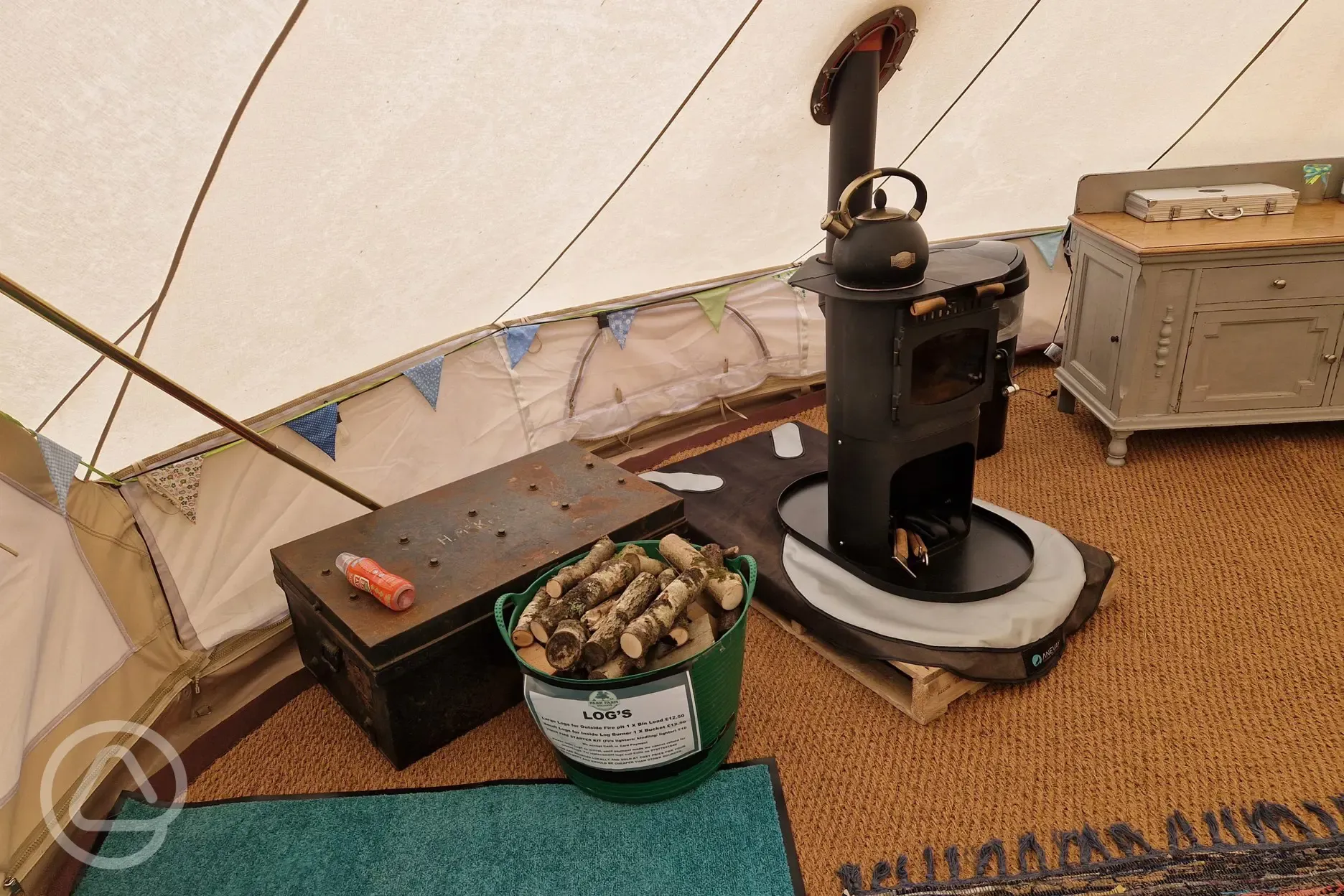 Green bell tent wood burner