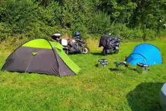 Non electric grass tent pitches