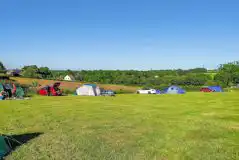 Camping field at Chalk Meadow with countryside views