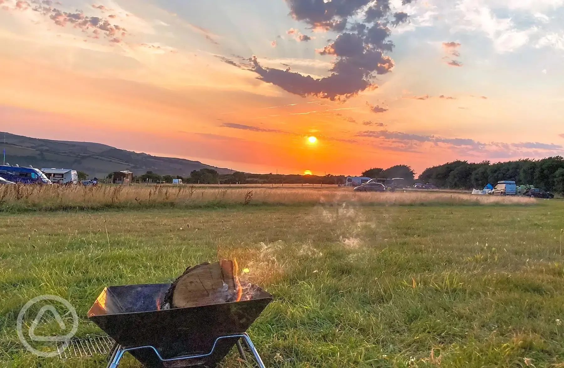 Camping field at sunset