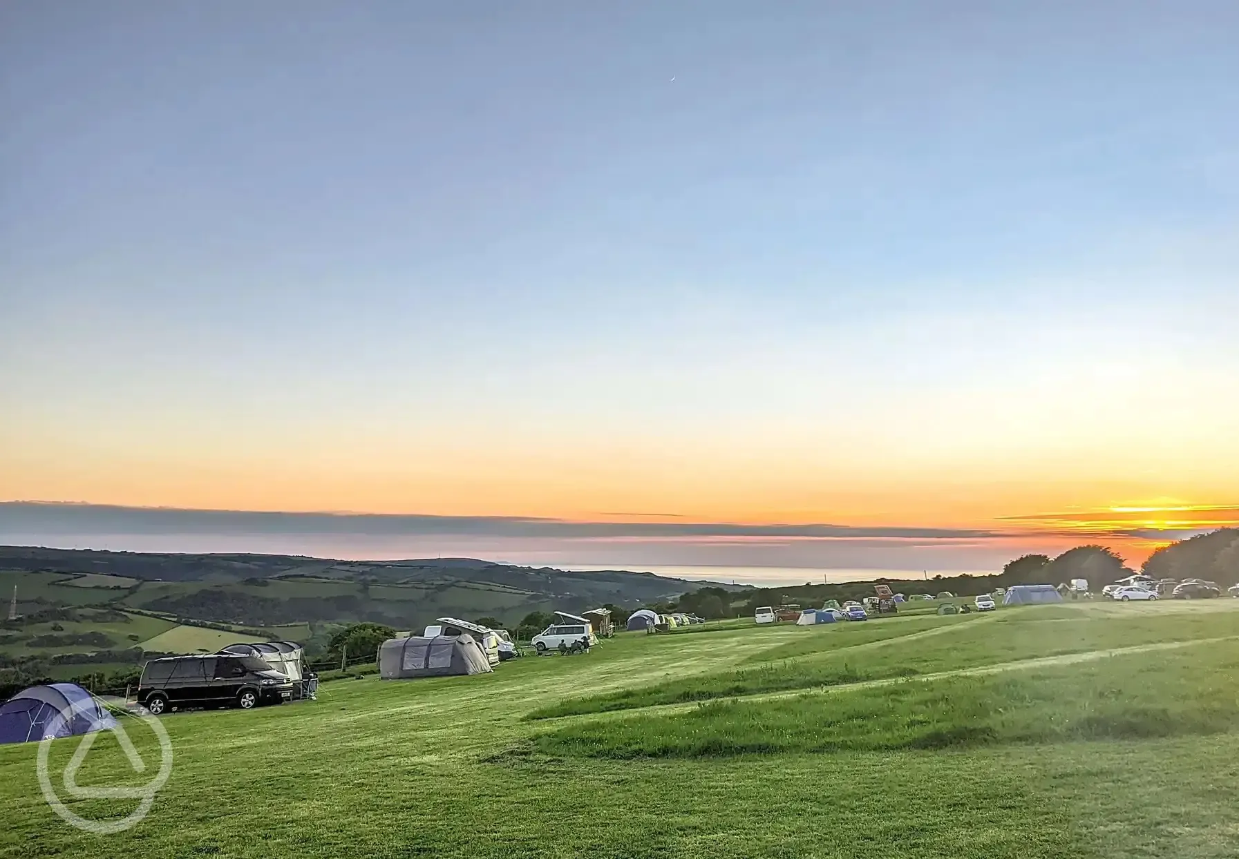 Camping field at sunset