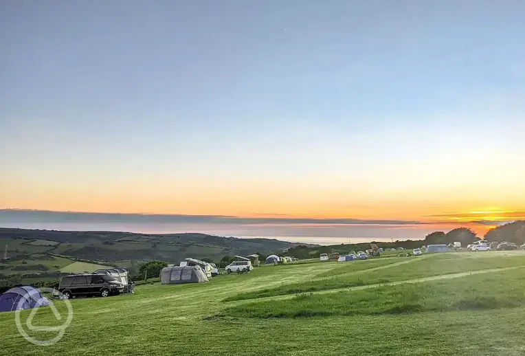 Camping field at sunset