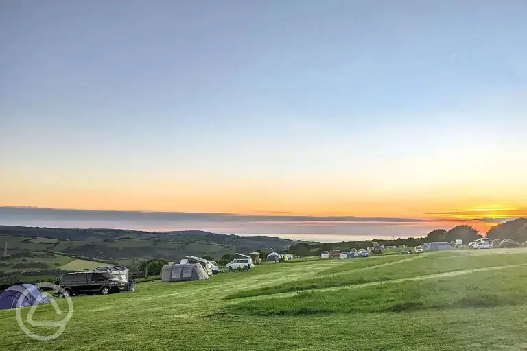 Camping field at sunset