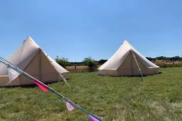 Bell tents with bunting at Summers Camping