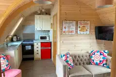 Squirrel pod sofa, TV and kitchenette