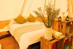 Bramble and Nettle bell tents with a double bed, camp beds, crockery and cutlery