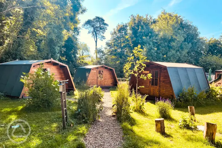 Camping pods in a garden area (cluster of five)