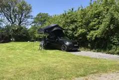 Hardstanding and grass pitch with optional electric for couples only Hardstanding and grass pitch with optional electric for couples only