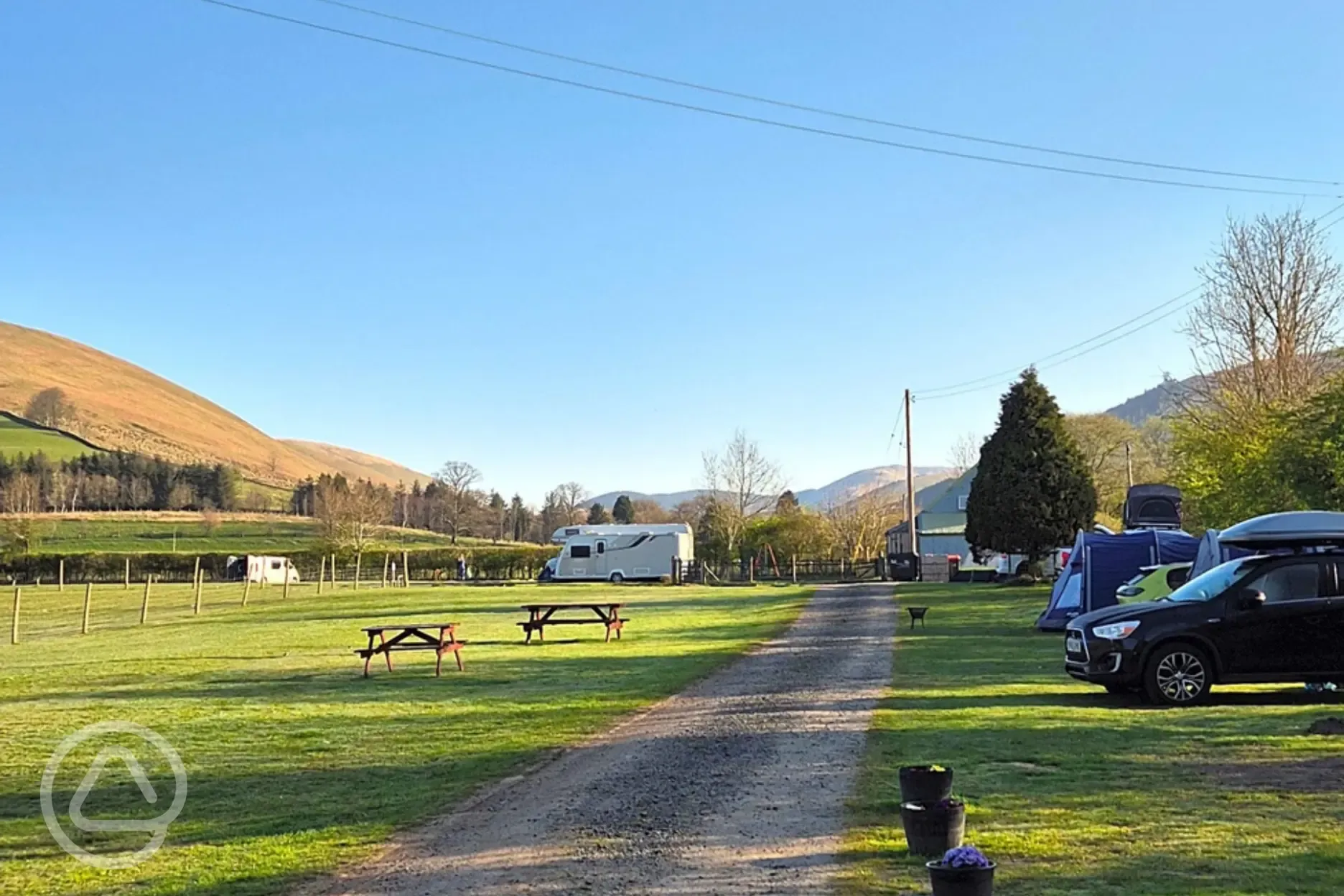 Grass mesh pitches with a road track around the site
