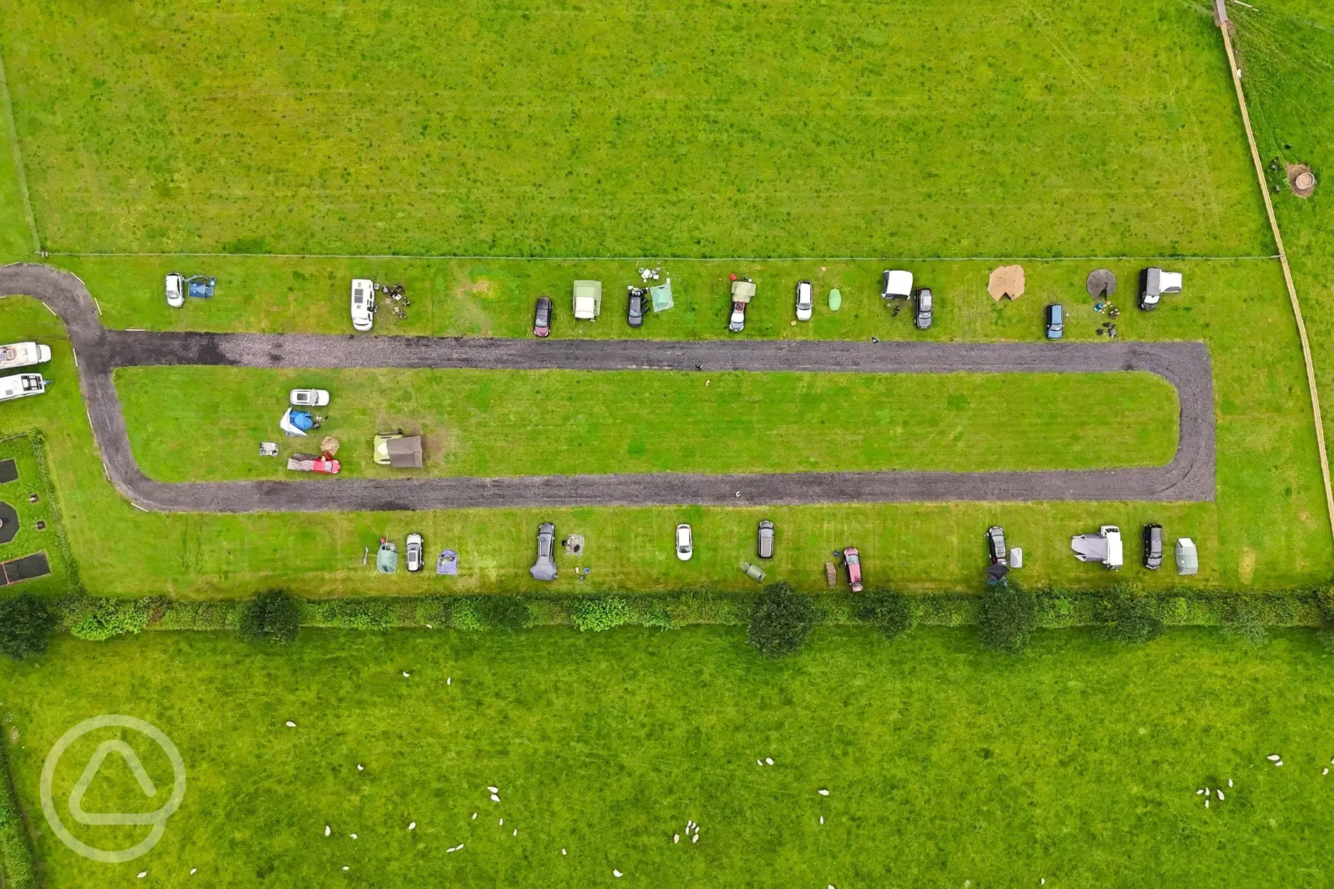 Bird's eye view of grass pitches and track around the site