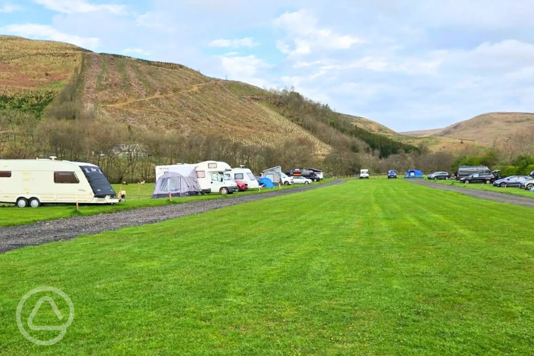Grass mesh pitches with a road track around the site