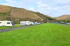 Grass mesh pitches with a road track around the site