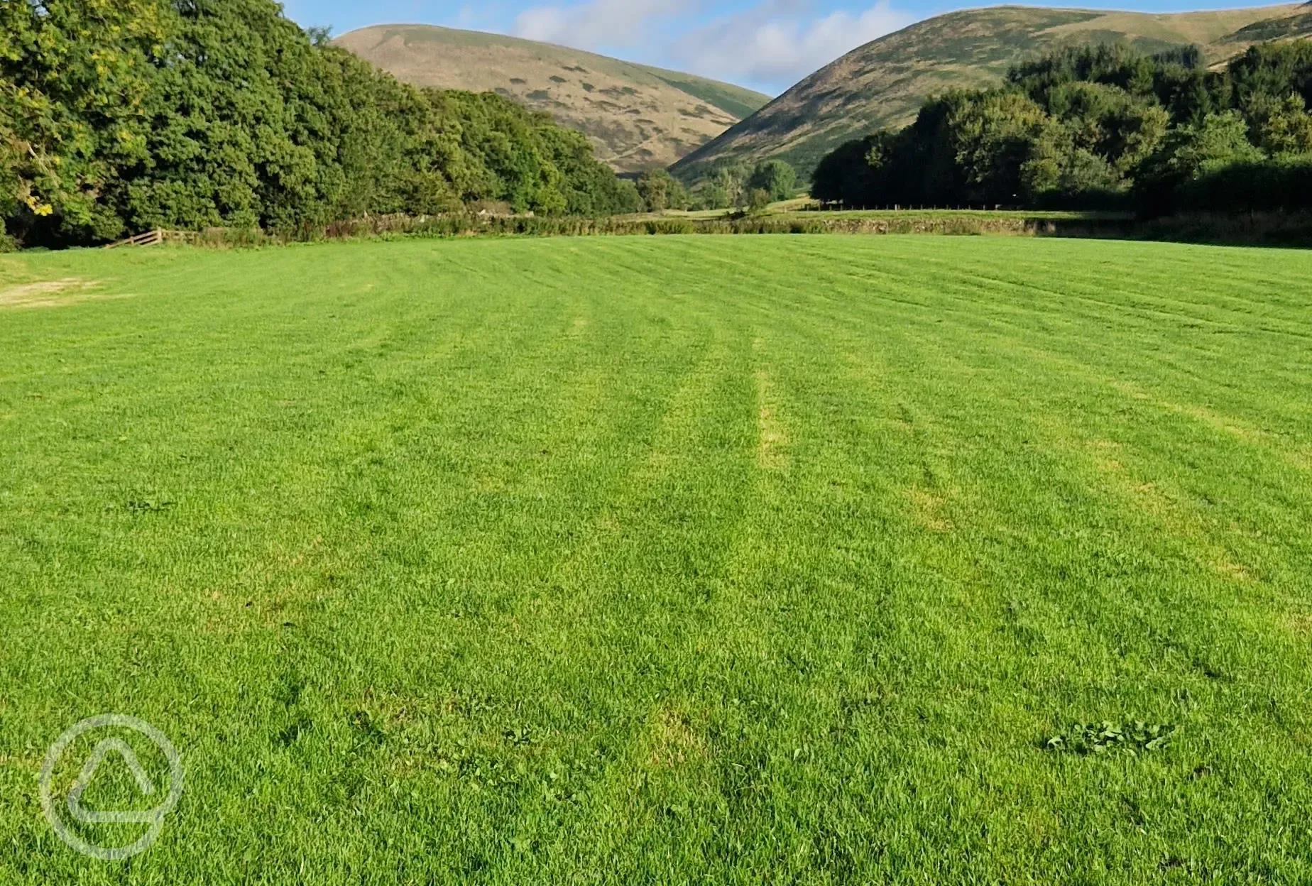 Grass pitches with mountain views