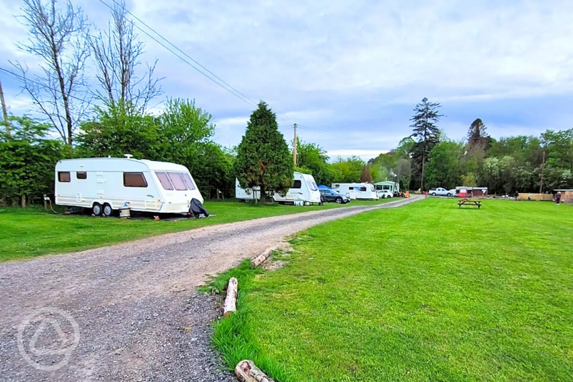 Grass mesh pitches with a road track around the site