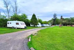 Grass mesh pitches with a road track around the site