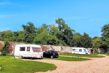 Electric 8m x 12m hardstanding pitches with space for a parked car