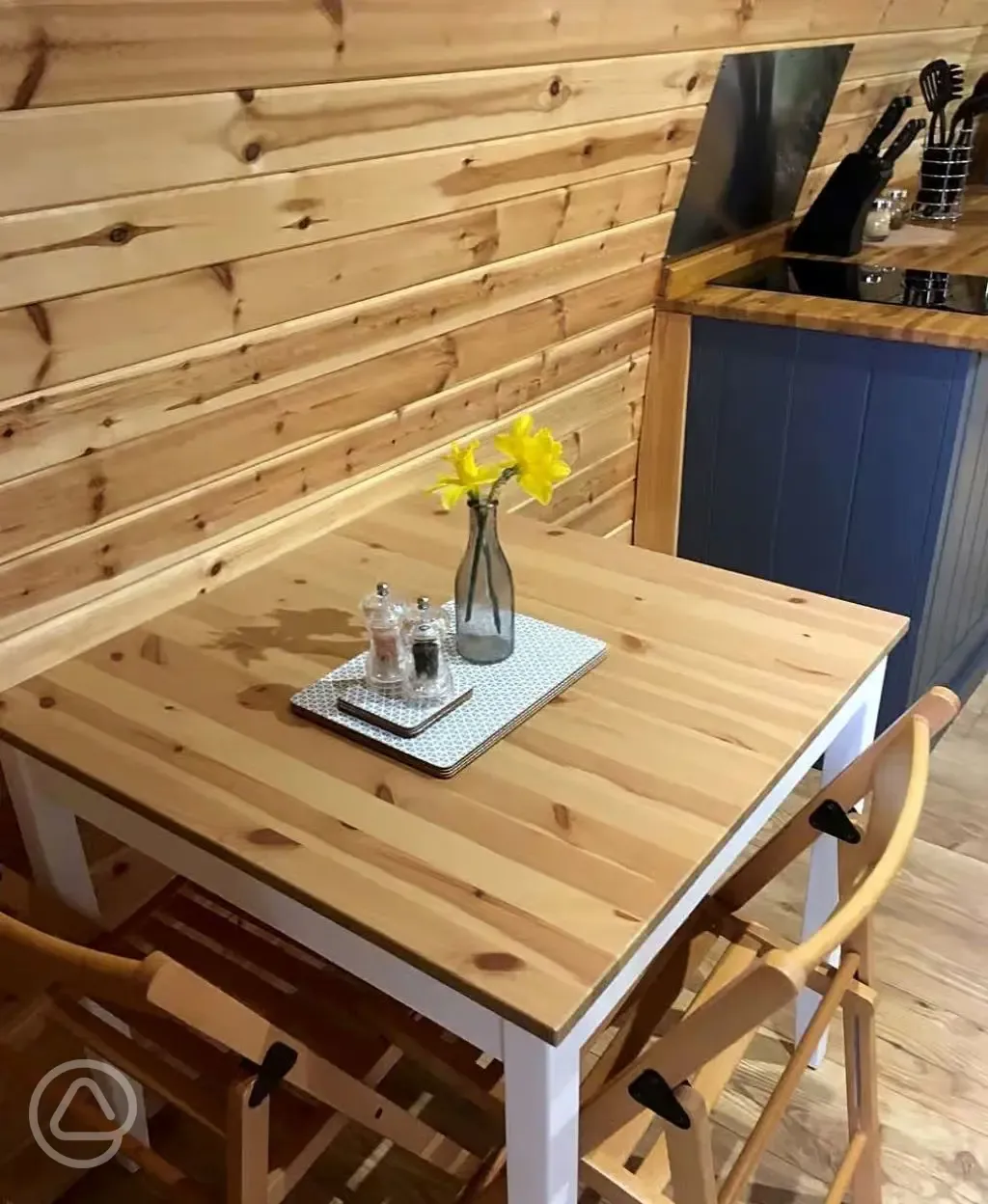 Pod dining table and chairs next to the kitchenette