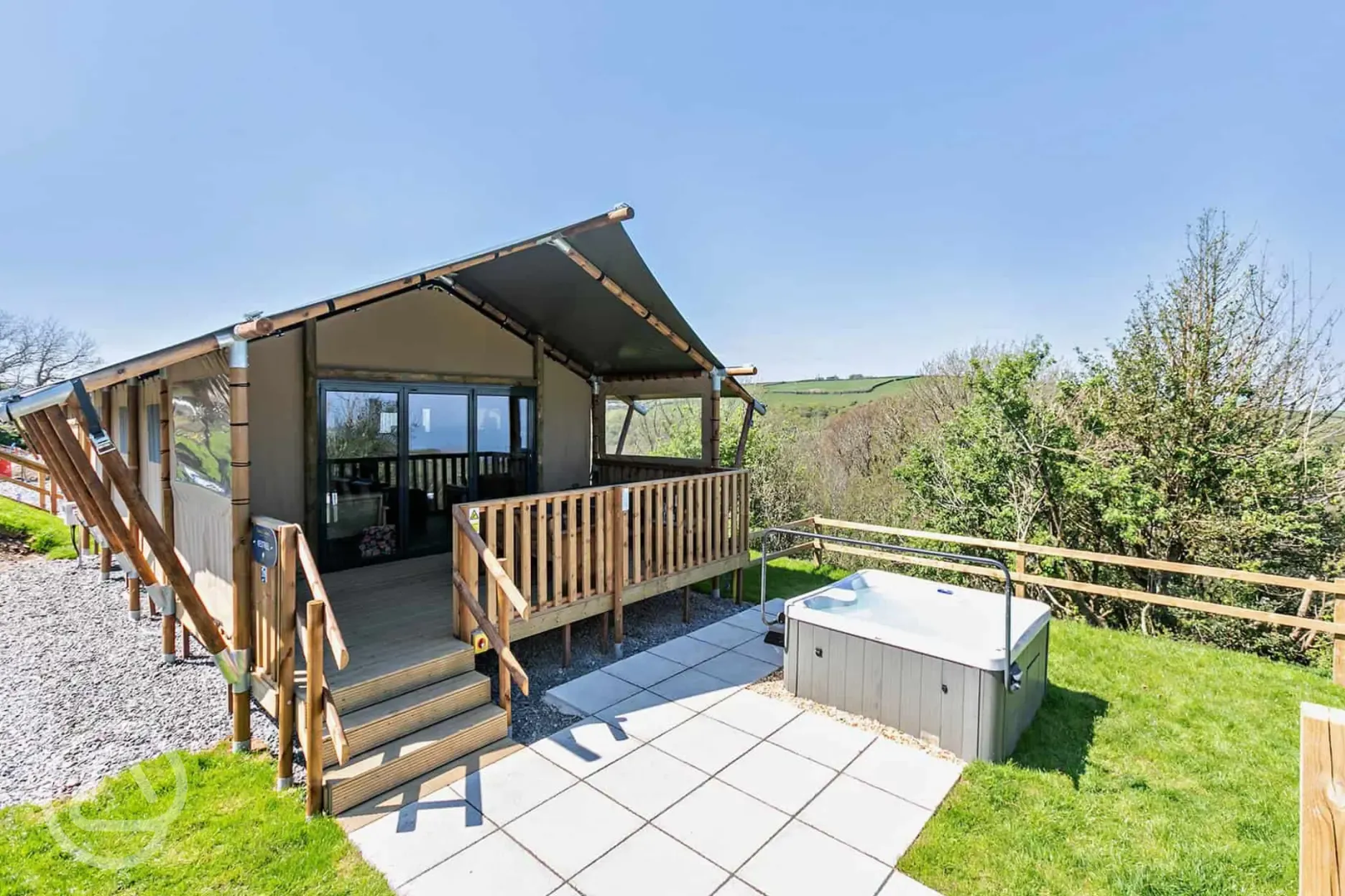 Safari tent with a decking area and hot tub