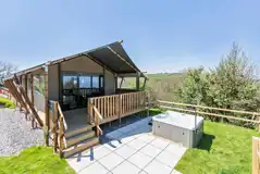 Safari tent with a decking area and hot tub