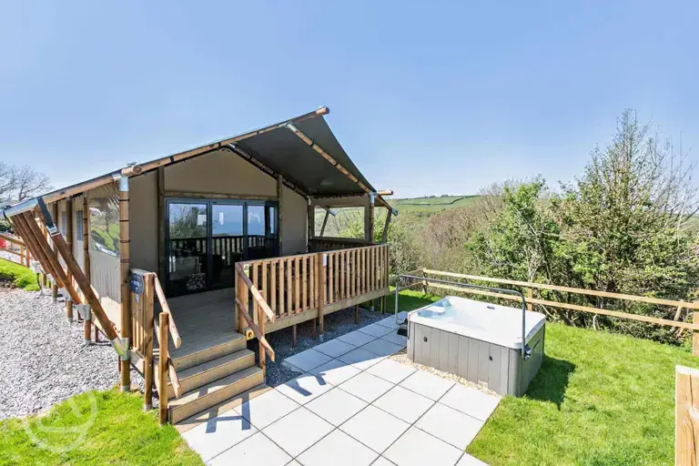 Safari tent with a decking area and hot tub