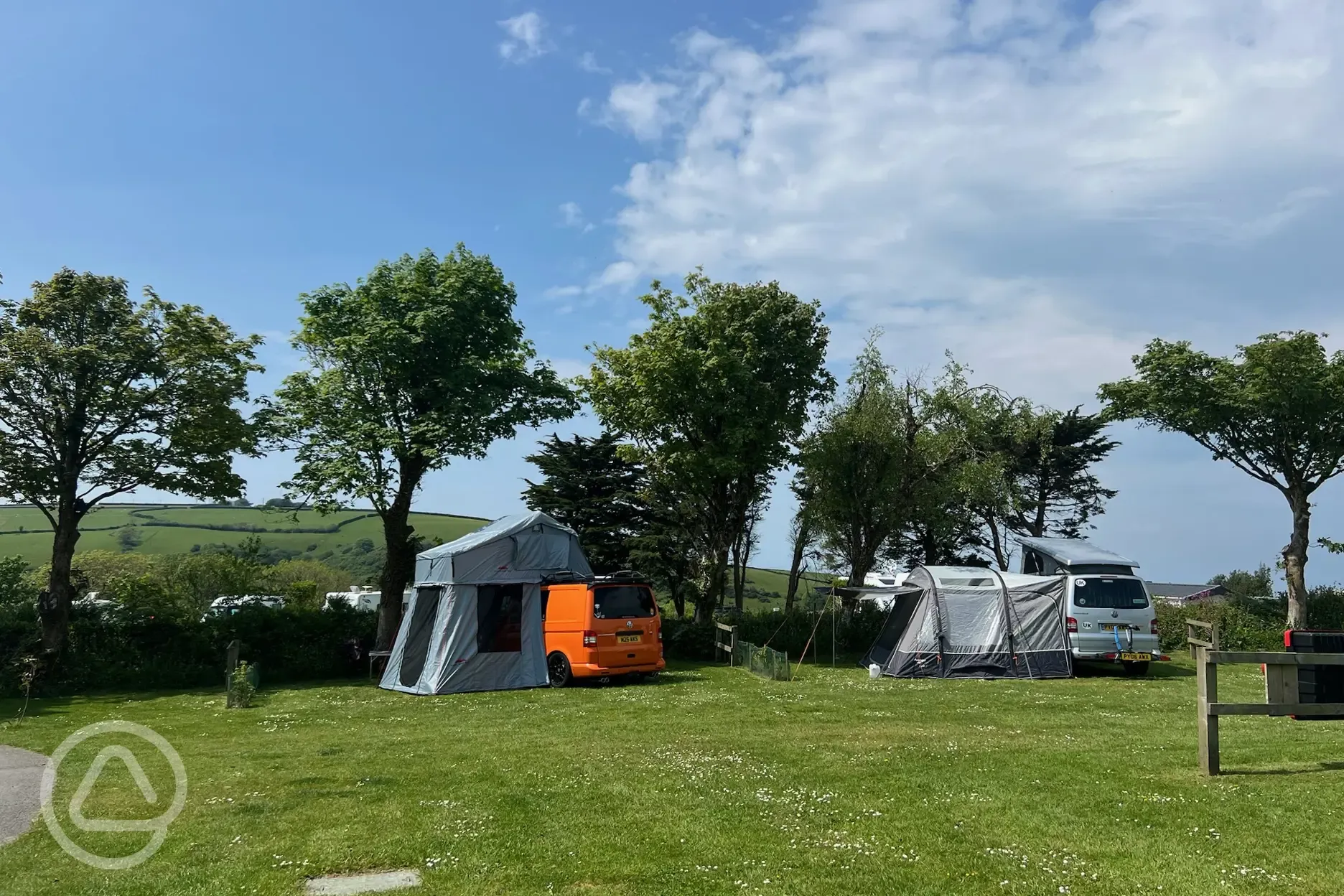 Roof tents and awnings on Beggar's Field electric grass pitches