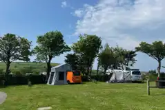 Roof tents and awnings on Beggar's Field electric grass pitches