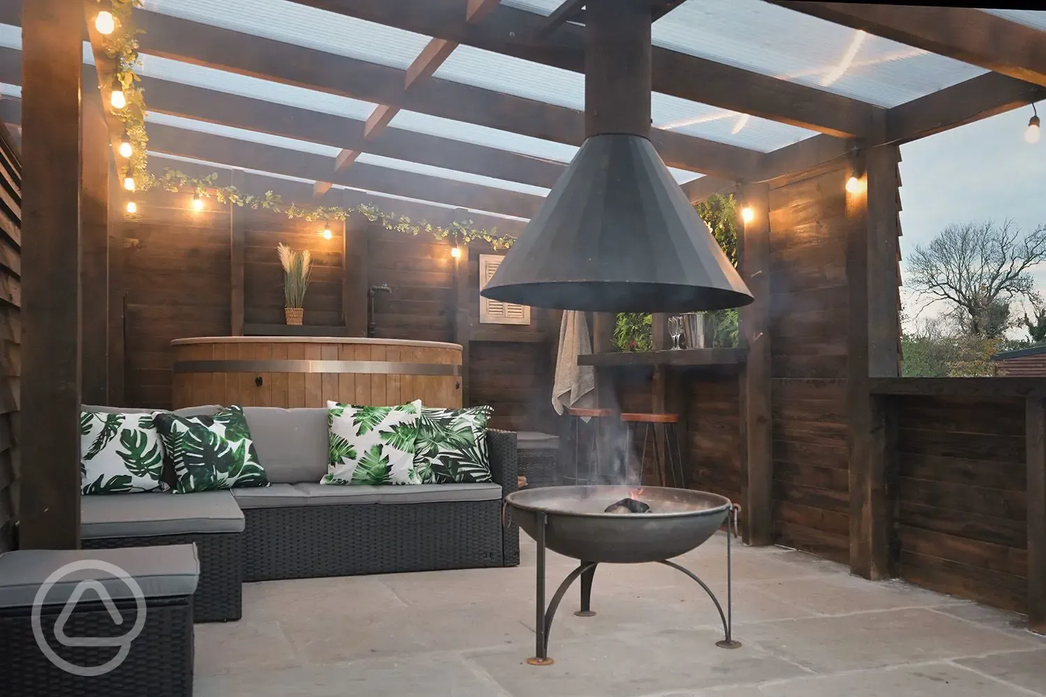 Private patio area with a fire pit at the Greenriggs Deluxe ensuite pod