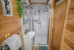 Ensuite with a toilet, shower, and sink in Moorlands, Waitby and Greenrigg pods Ensuite with a toilet, shower, and sink in Moorlands, Waitby and Greenrigg pods