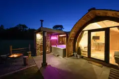 Enterber ensuite glamping pod at night time Enterber ensuite glamping pod at night time