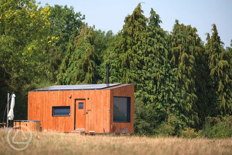 Fox glamping cabin with a wood-fired hot tub and countryside views