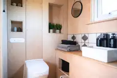 Glamping cabin ensuite bathrooms with eco toilets and showers