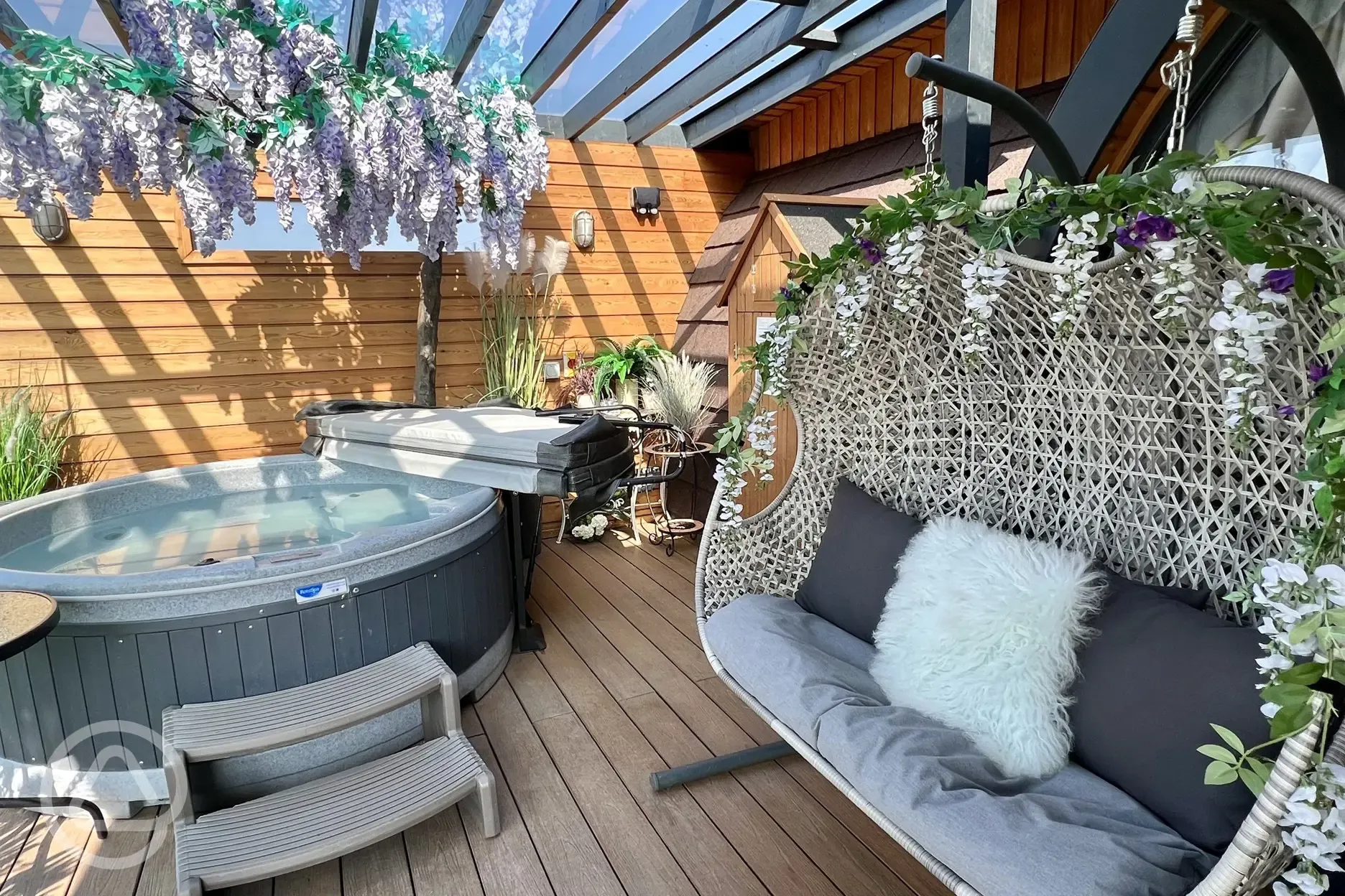 Outdoor hot tub and seat swing