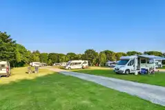 Grass 3m x 8m pitches with 16 amp electric hook ups