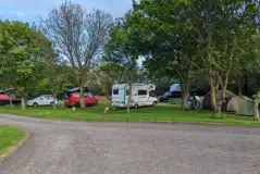 Grass 3m x 8m pitches with 16 amp electric hook ups