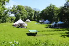 Furnished bell tents (sleeping two to six) Furnished bell tents (sleeping two to six)