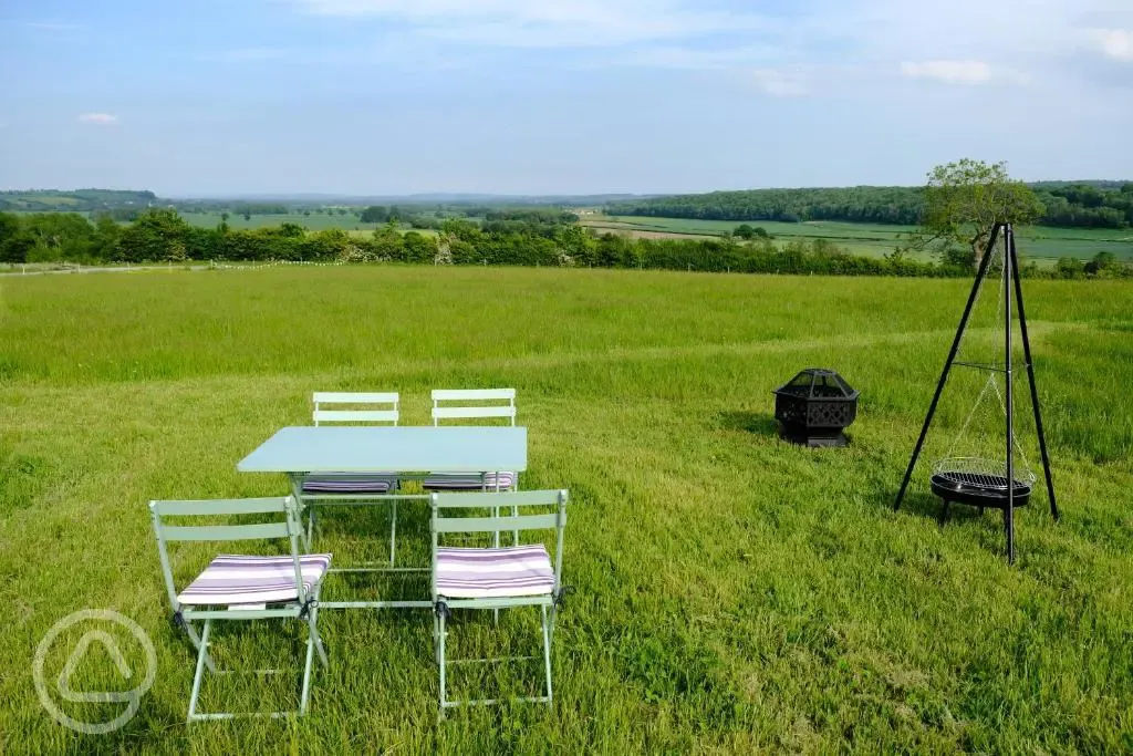 Bell tent outdoor seating area and fire pit