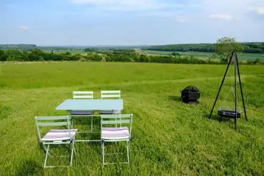 Bell tent outdoor seating area and fire pit