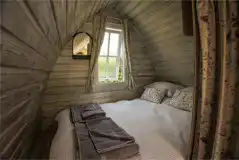 Bumblebee interior with a double bed, bedding and towels Bumblebee interior with a double bed, bedding and towels