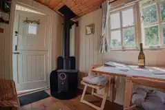 Shepherd's hut interior with a wood burner Shepherd's hut interior with a wood burner