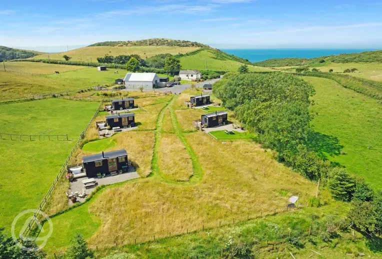 Aerial of the site with sea views