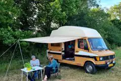 Campervan on a non electric grass pitch Campervan on a non electric grass pitch