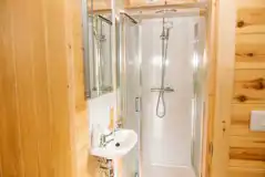 Glamping pod ensuite shower and handwashing sink