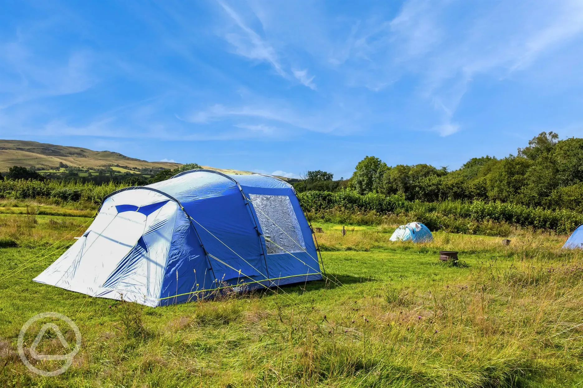 Non electric grass tent pitches with mountain views Non electric grass tent pitches with mountain views
