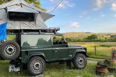 Non electric grass campervan pitches with fire pit and countryside views Non electric grass campervan pitches with fire pit and countryside views