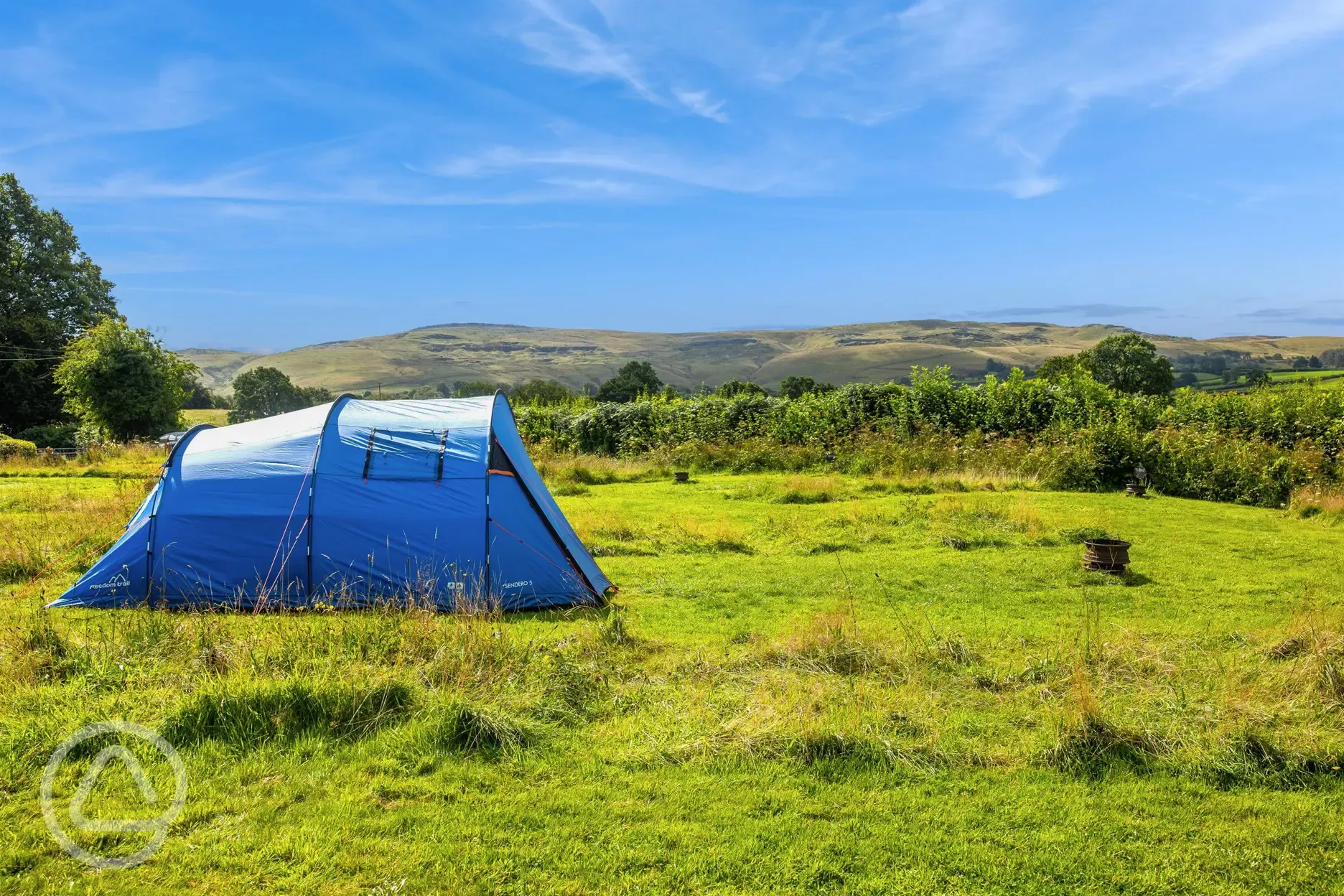 Non electric grass tent pitches surrounded by countryside views Non electric grass tent pitches surrounded by countryside views