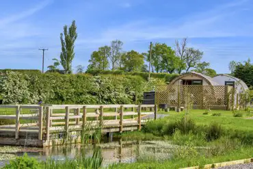 Glamping pods by the pond